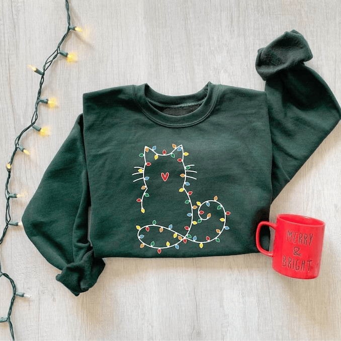 Adorable cat Christmas sweatshirt for women, perfect gift for cat lovers, featuring festive holiday design and cute Xmas graphic for cozy winter days